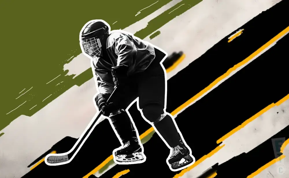 A hockey player in silhouette, holding a stick.