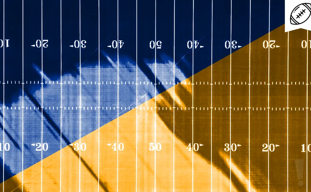 Football field with blue and gold halves, marked with yard lines and numbers.