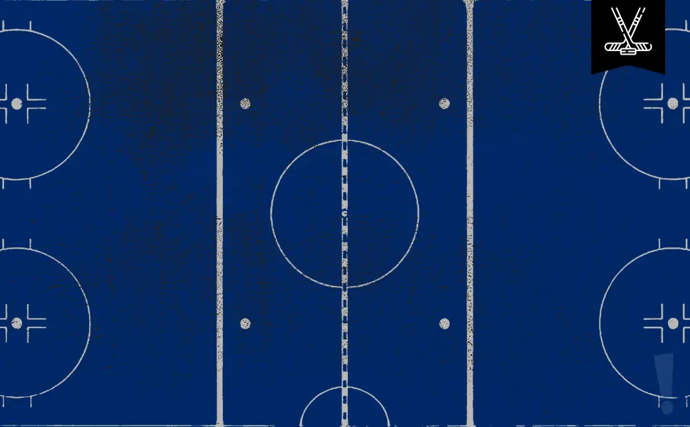 Top-down view of a blue hockey rink with white lines and markings, including a logo of crossed hockey sticks.