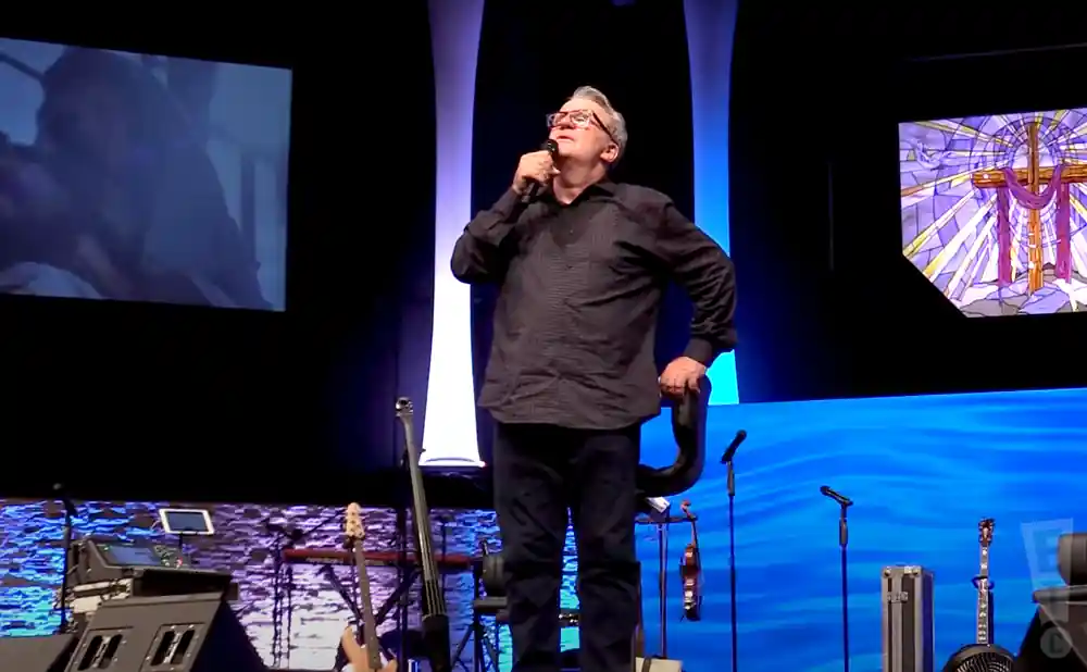 mark lowry doing his standup act on stage