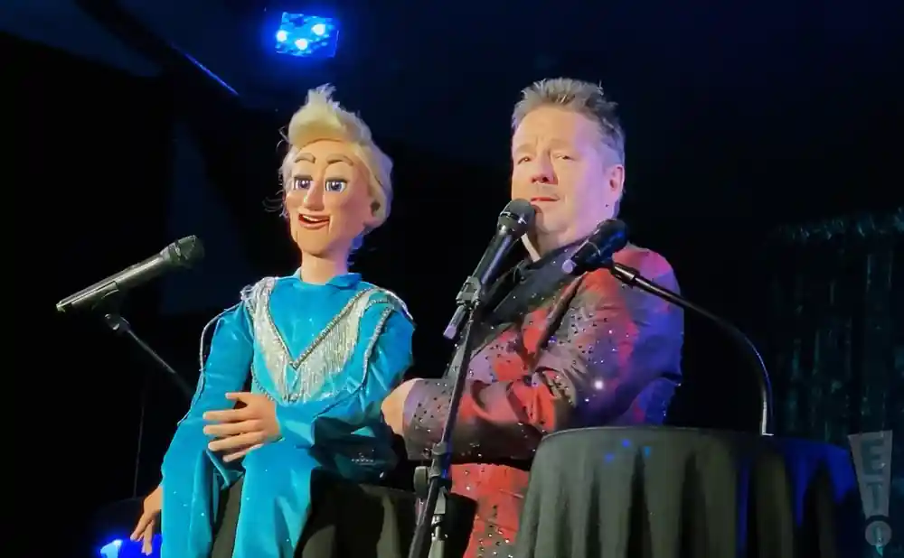 terry fator performing on stage with puppet