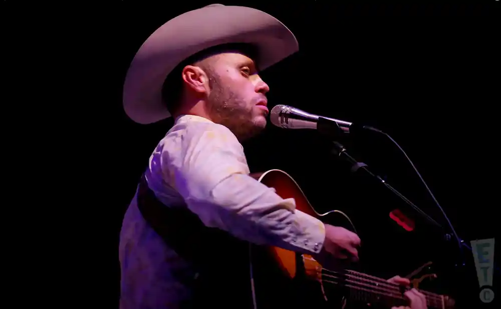 charley crockett performing at the whitewater amphitheater in new braunfels texas