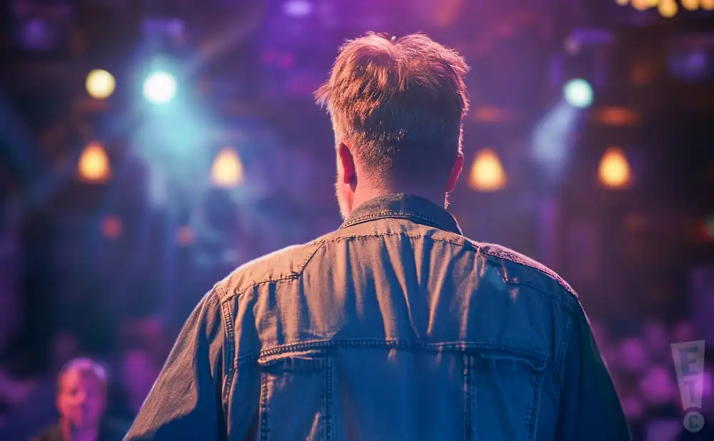 a rear view image of the singer from taylor's thread band performing live on stage