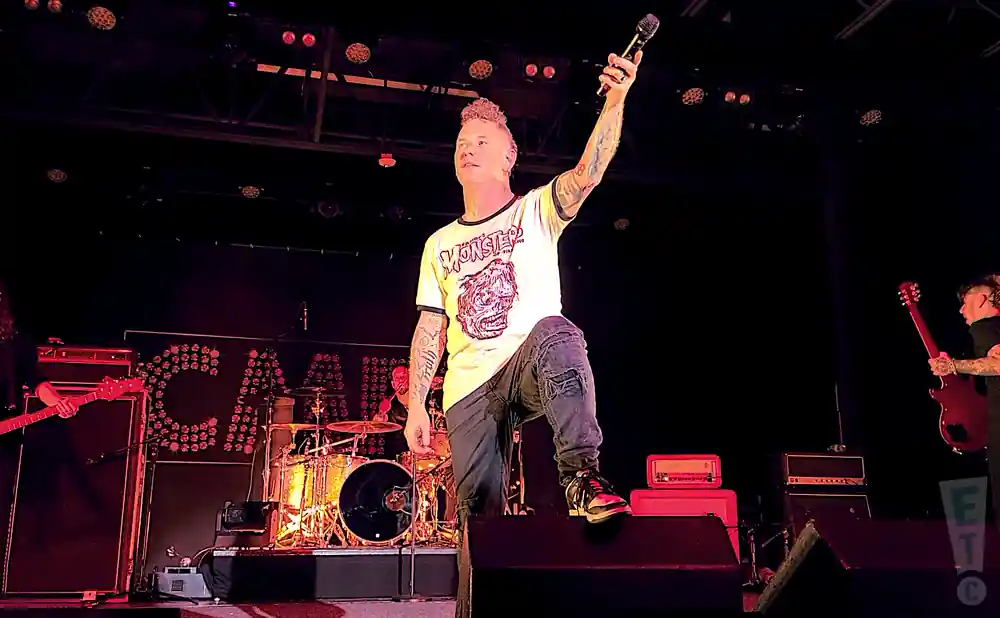 corey taylor singing live on stage in white tshirt