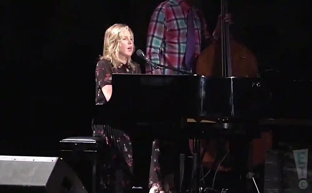 diana krall performing the song the look of love live on a dim lit stage