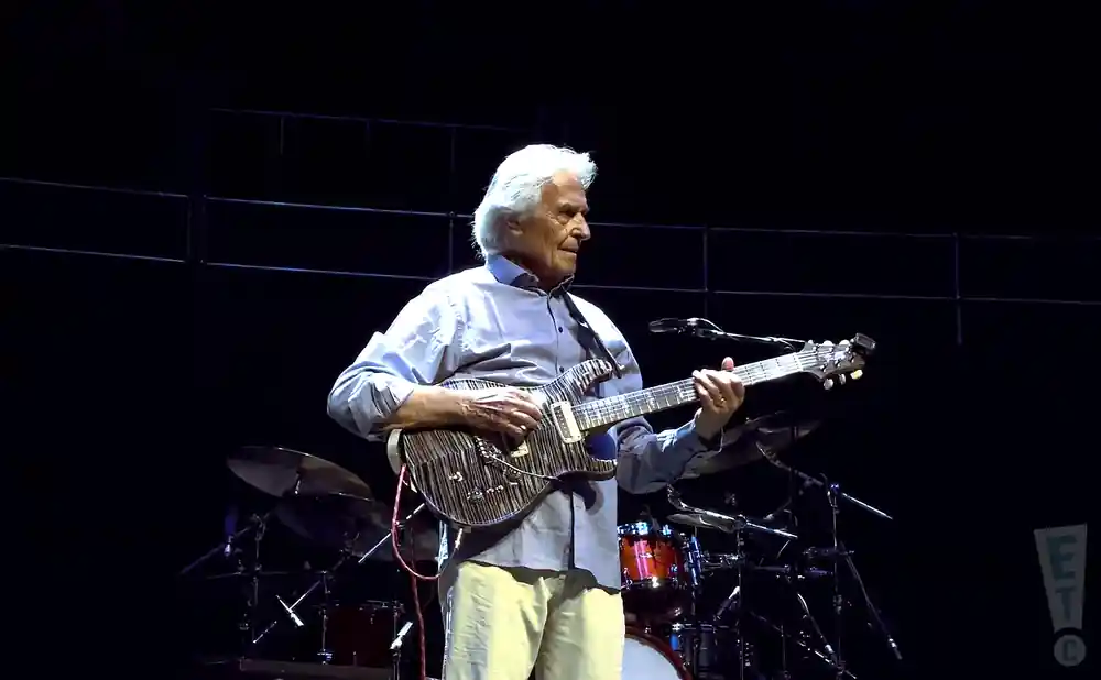 john mclaughlin playing a electric guitar at the tribute to jeff beck concert