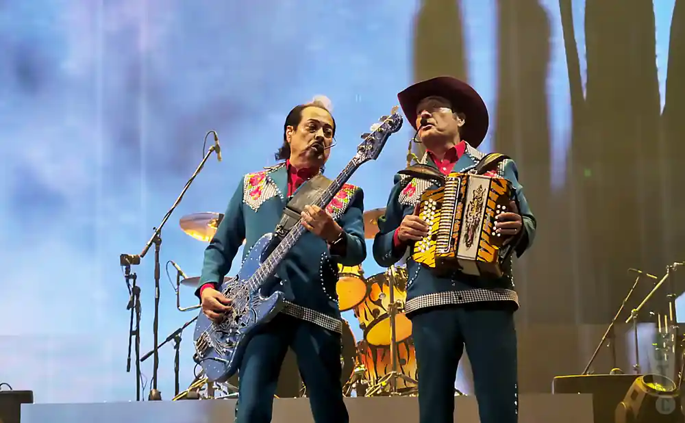 los tigres del norte shot of accordionist and lead bass player performing on stage