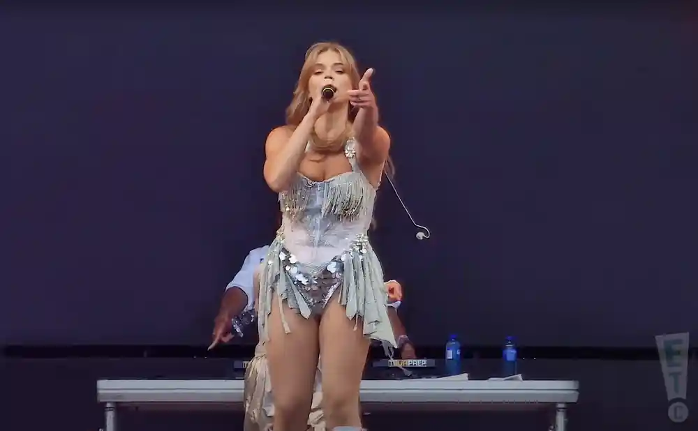 becky hill performing on stage to a large crowd in palmesus