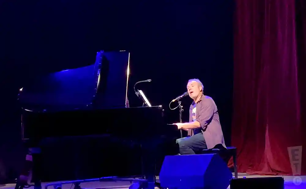 five for fighting on stage playing the piano and singing