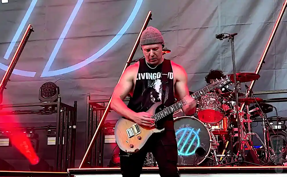 i prevail electric guitarist playing live on stage