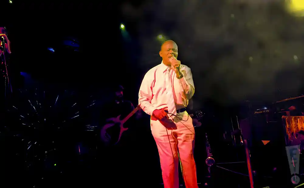 jimmy brown singing live in a white suit and pants