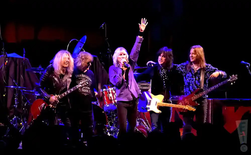 kix posing on stage together at warehouse live in houston texas