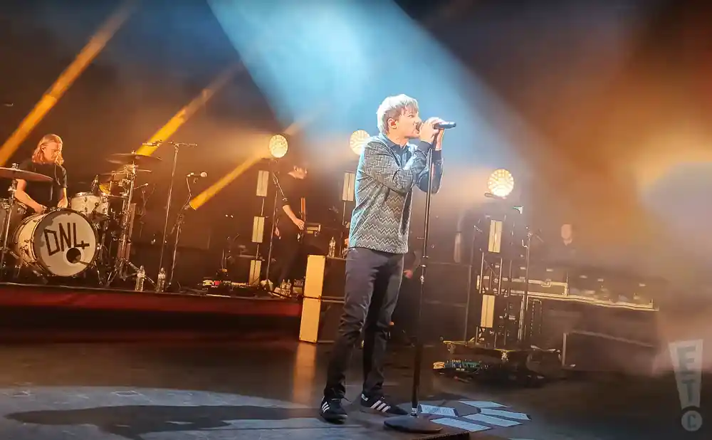 louis tomlinson performing on stage at the shepherd's bush empire in london england