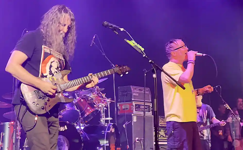 mr bungle performing on stage shot of singer and guitarist