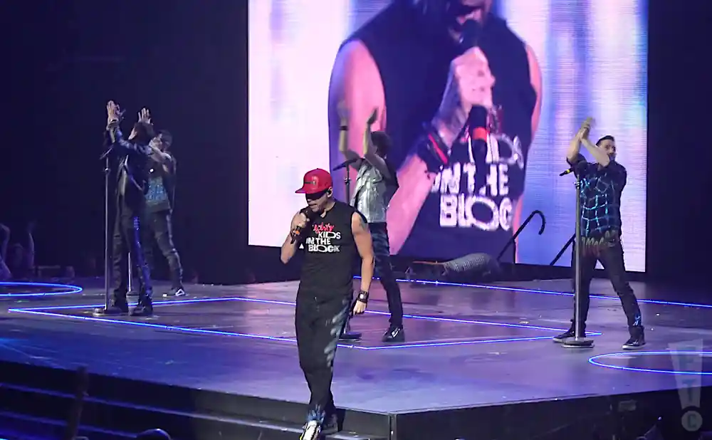 new kids on the block performing on stage shot of whole group