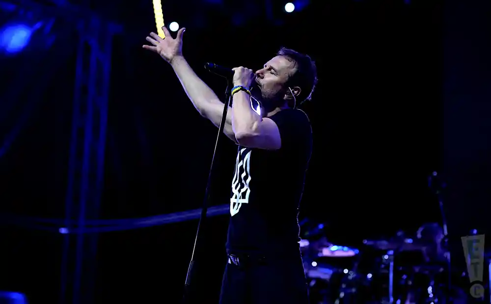 okean elzy performing on stage singer and guitarist in shot