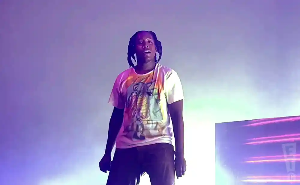 don toliver performing on stage in front of fog