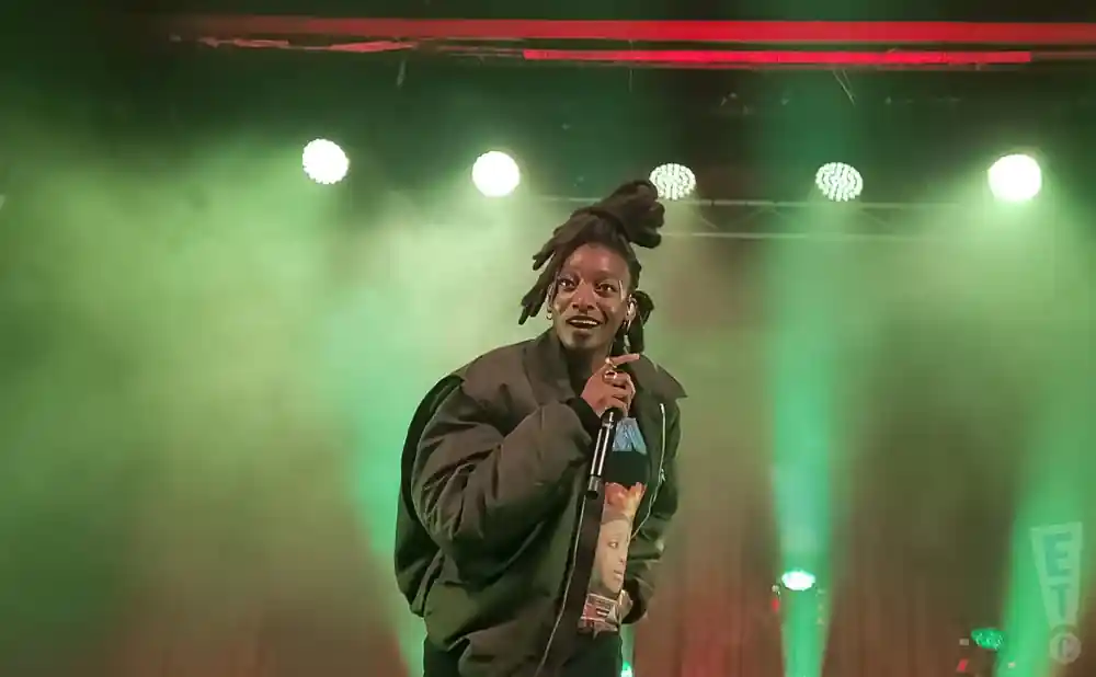 little simz rapping in front of green at the academy in dublin ireland