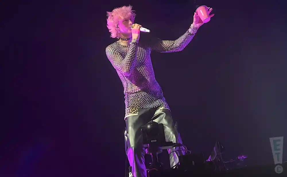 a live performance of machine gun kelly performing in north dakota