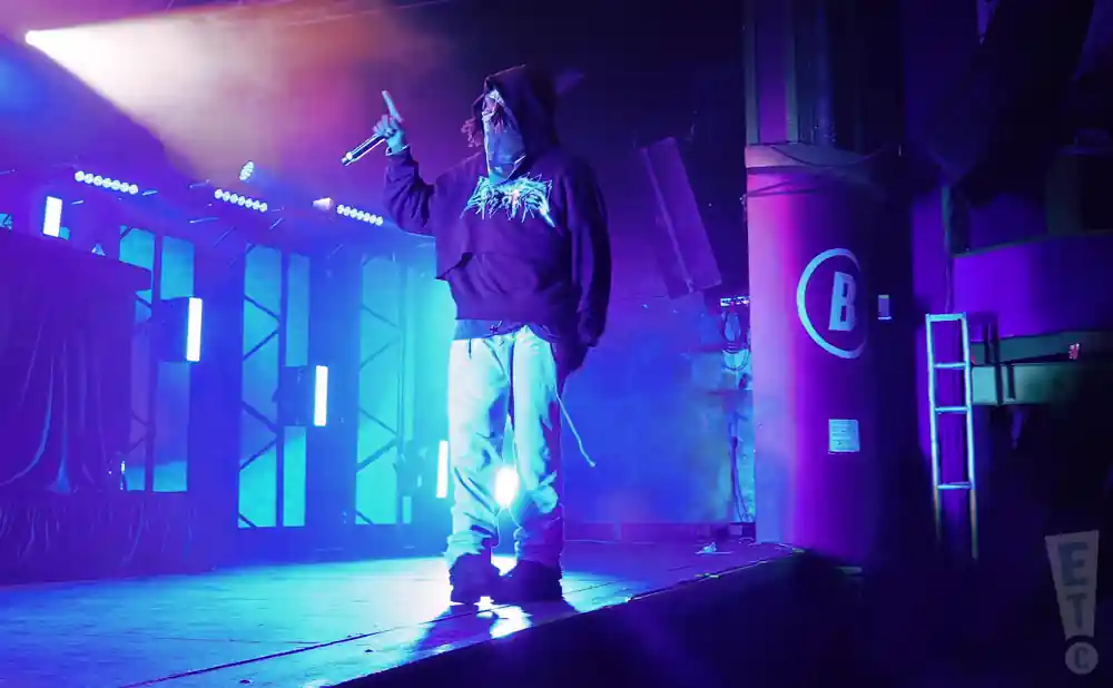 $not performing on stage in blue lights