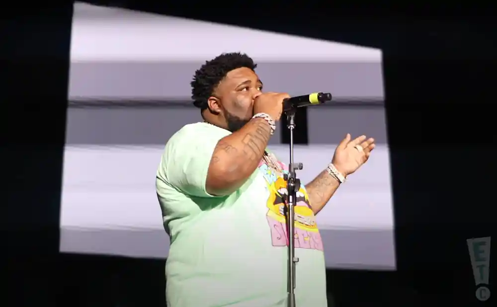 rod wave singing on stage during a live performance at the greensboro coliseum complex