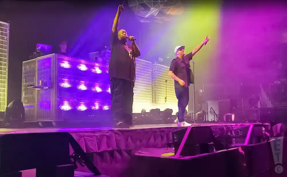run the jewels performing on stage under purple lights
