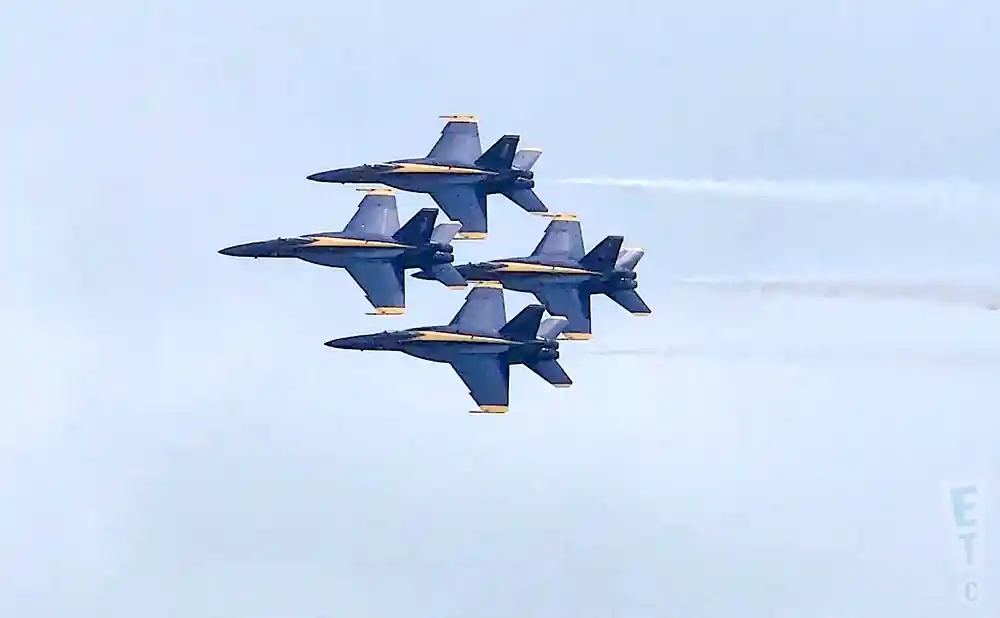 four jetplanes performing in aerial show.
