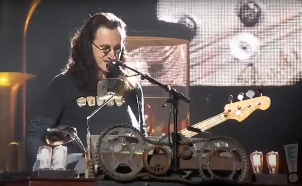 geddy lee performing on stage at scottrade center in st. louis