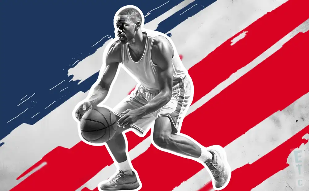 a grand rapids gold basketball player looks down the court with a basketball in his hand