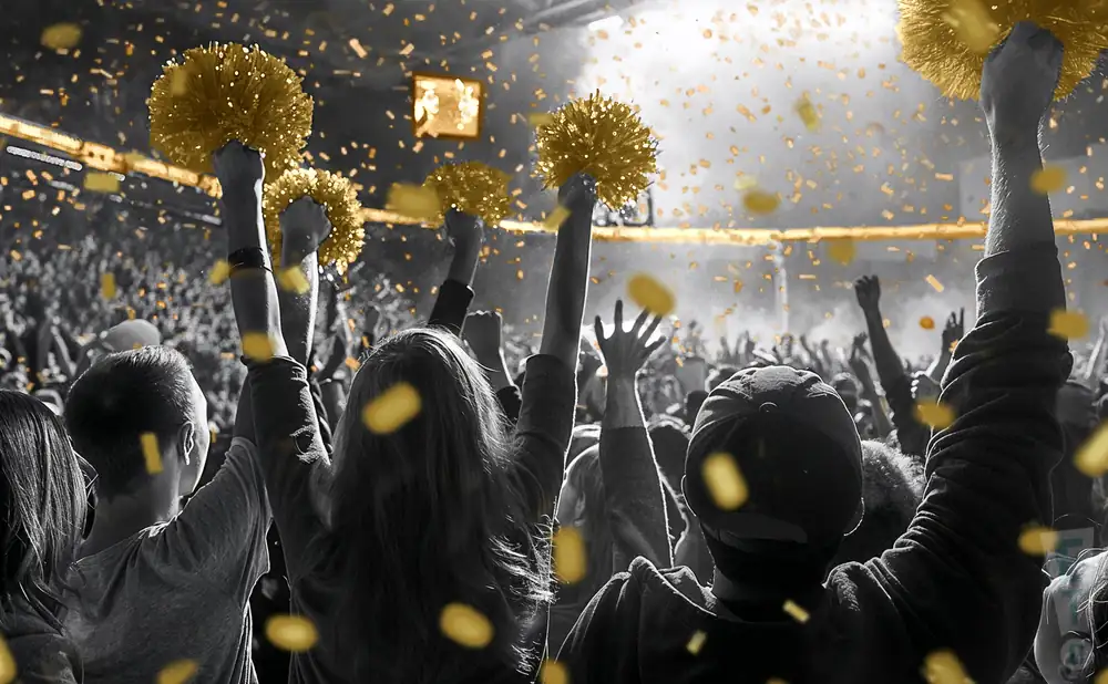 a crowd of alabama state hornets fans cheering for their basketball team