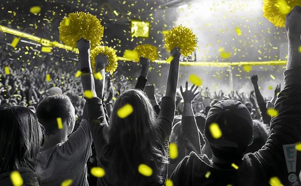 a crowd of appalachian state mountaineers fans cheering for their football team
