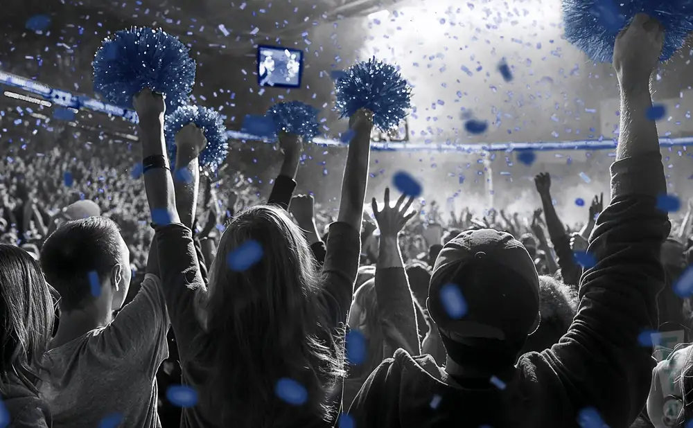 a crowd of csm orediggers fans cheering for their football team