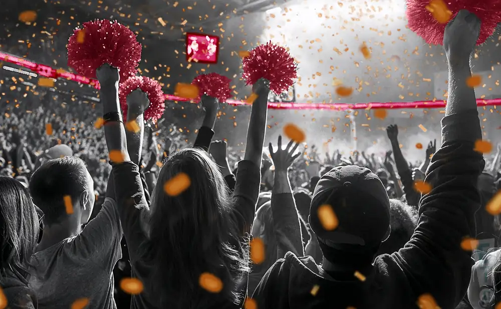 a crowd of maryville college scots fans cheering for their football team