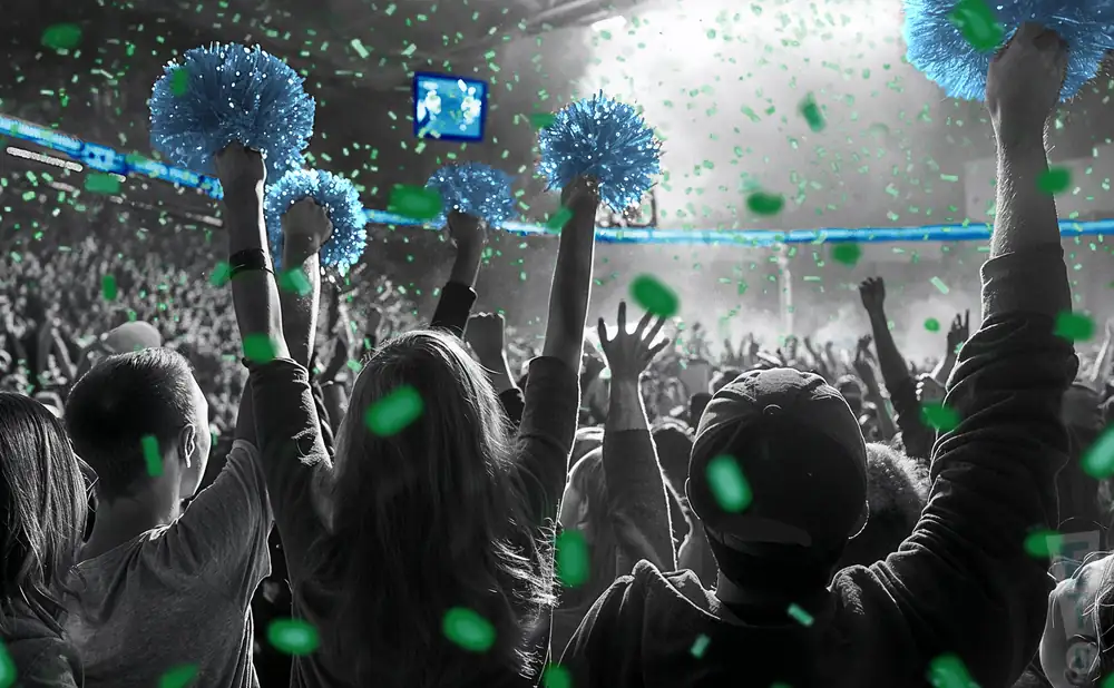 a crowd of tulane green wave fans cheering for their football team