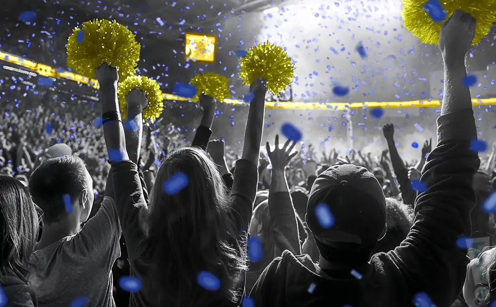 a crowd of uc san diego tritons fans cheering for their basketball team