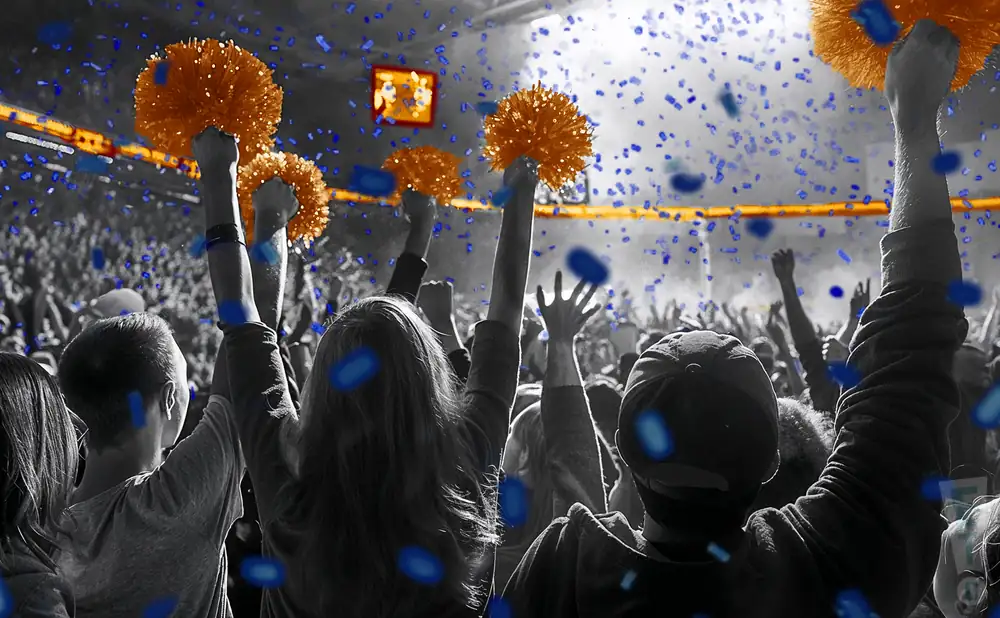 a crowd of utsa roadrunners fans cheering for their football team