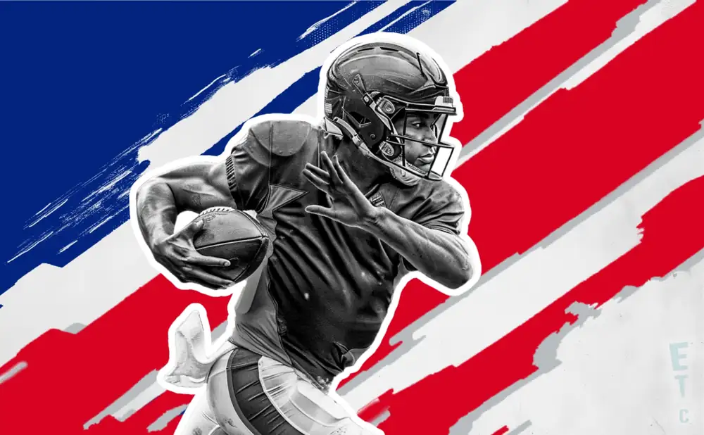 a new york giants football player runs with the ball