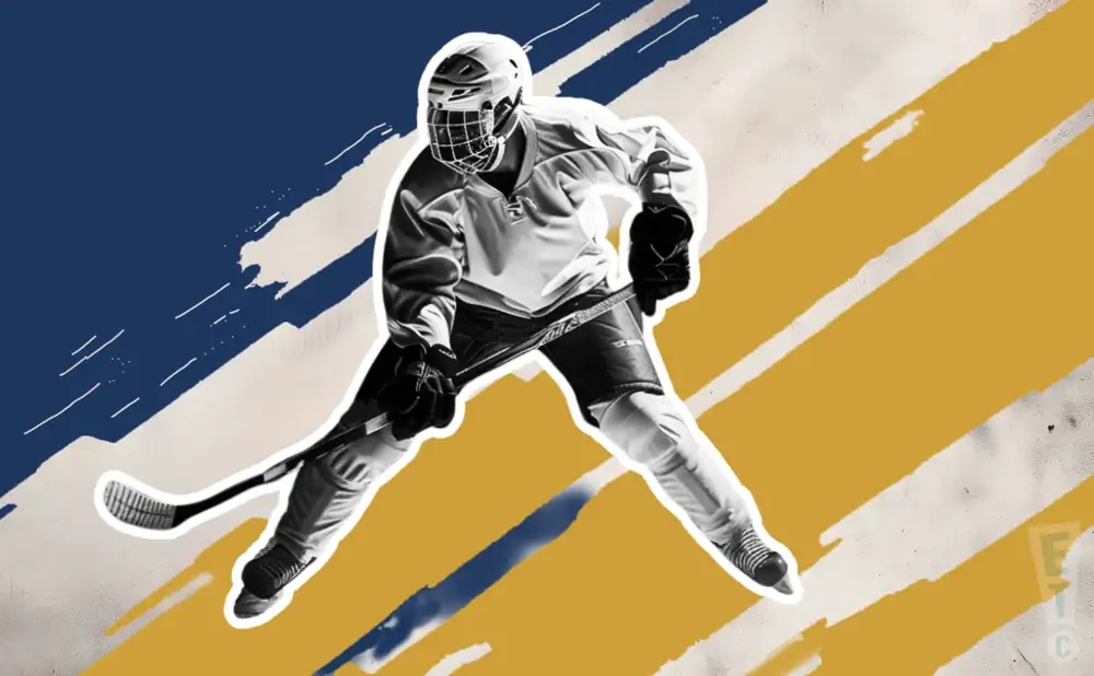 a janesville jets ice hockey player about to hit the puck