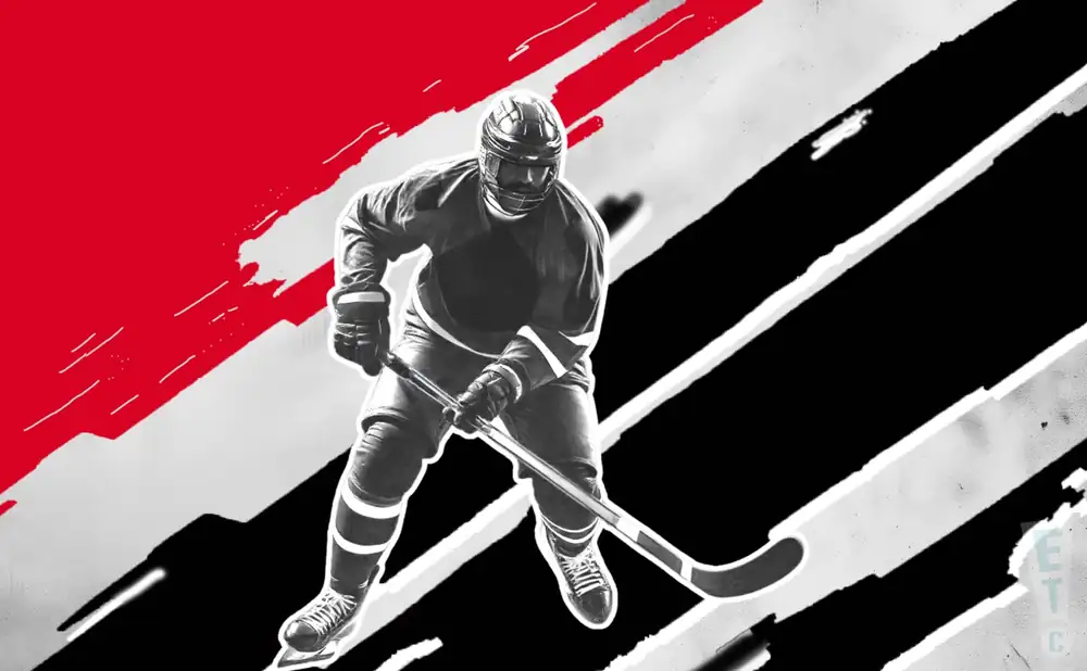 a new jersey devils hockey player about to hit the puck