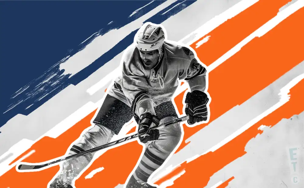 a northeast generals ice hockey player about to hit the puck