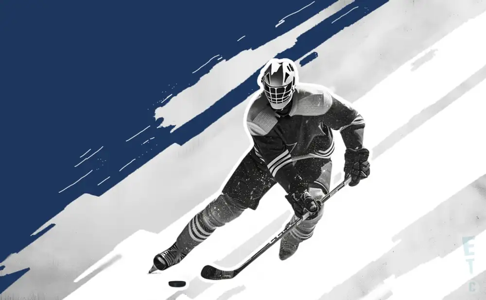 a toronto maple leafs hockey player about to hit the puck