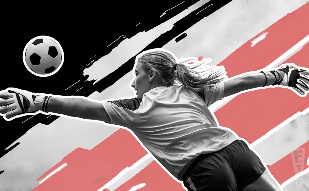 an angel city fc goalie soccer playerdiving to catch the ball