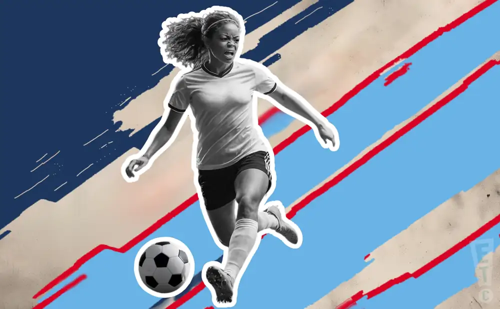 an ol reign soccer player kicking the ball down field