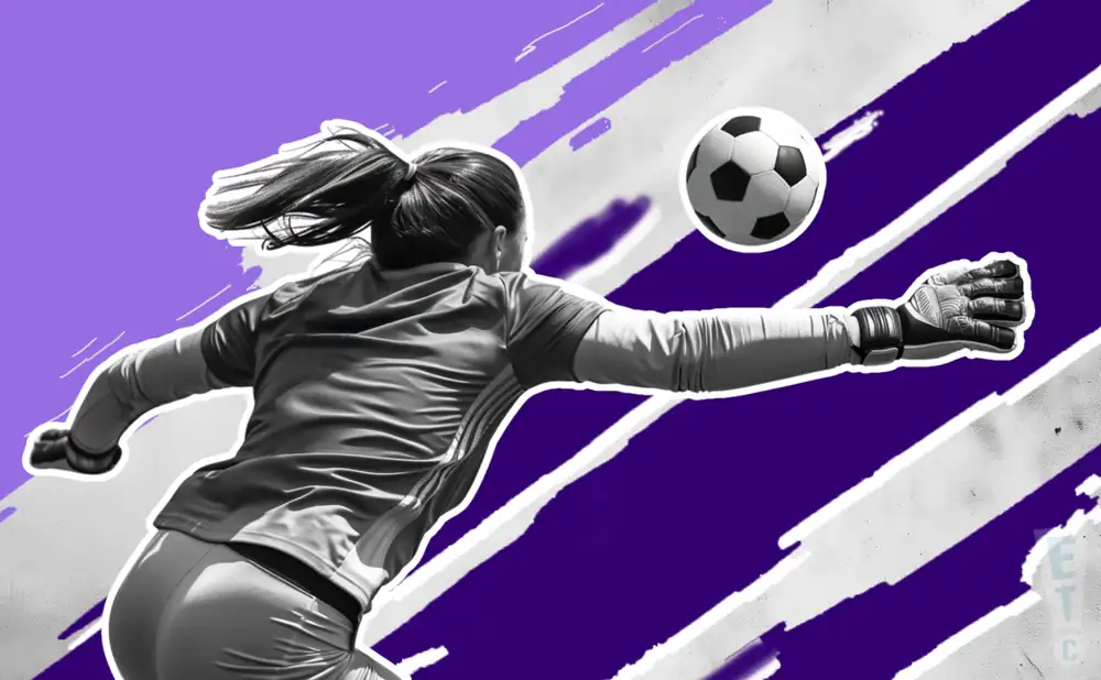 a racing louisville fc soccer player kicking the ball down field