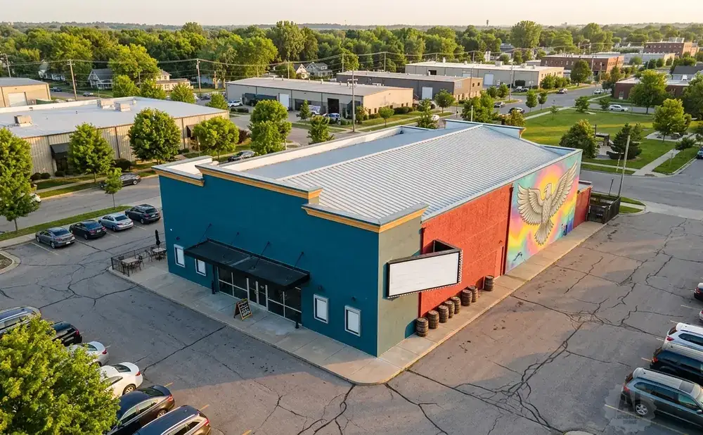 A brightly colored building with a mural of a bird.