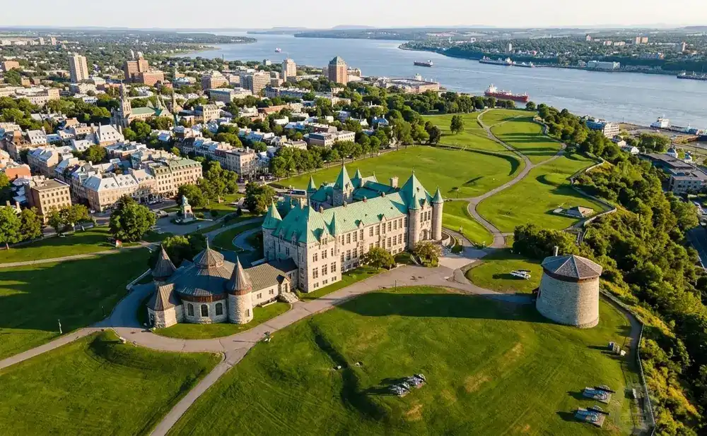 Aerial view of the Plains of Abraham, showing the Château Frontenac and the St. Lawrence River in Quebec City.