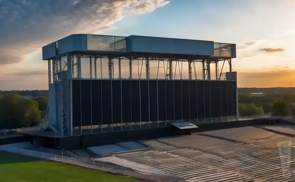 Aerial view of a stadium scoreboard at sunset.