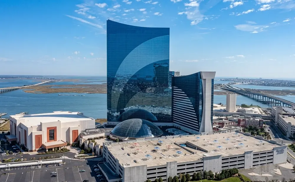Aerial view of the Hard Rock Hotel & Casino Atlantic City, featuring its iconic guitar-shaped building and surrounding infrastructure.