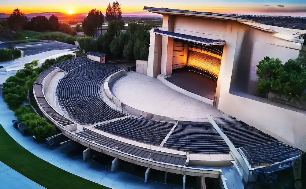 An aerial view of an outdoor amphitheater at sunset.