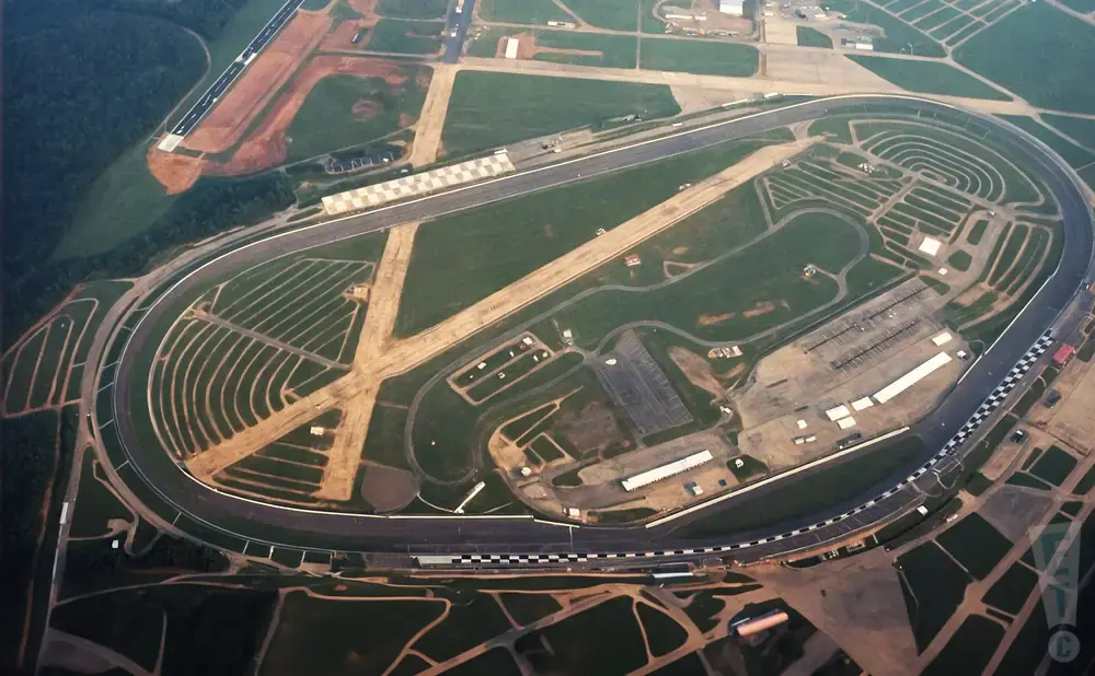Aerial view of a race track and airport.